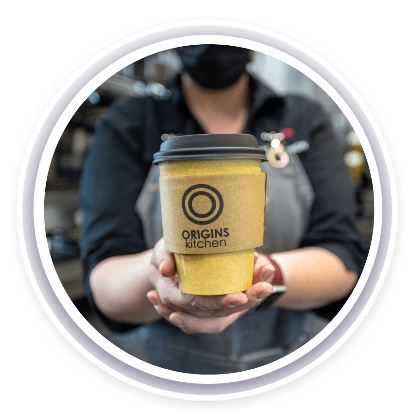 Takeout coffee cup with Origins Kitchen logo